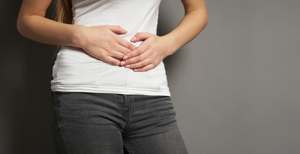 young woman with bellyache or menstrual cramps